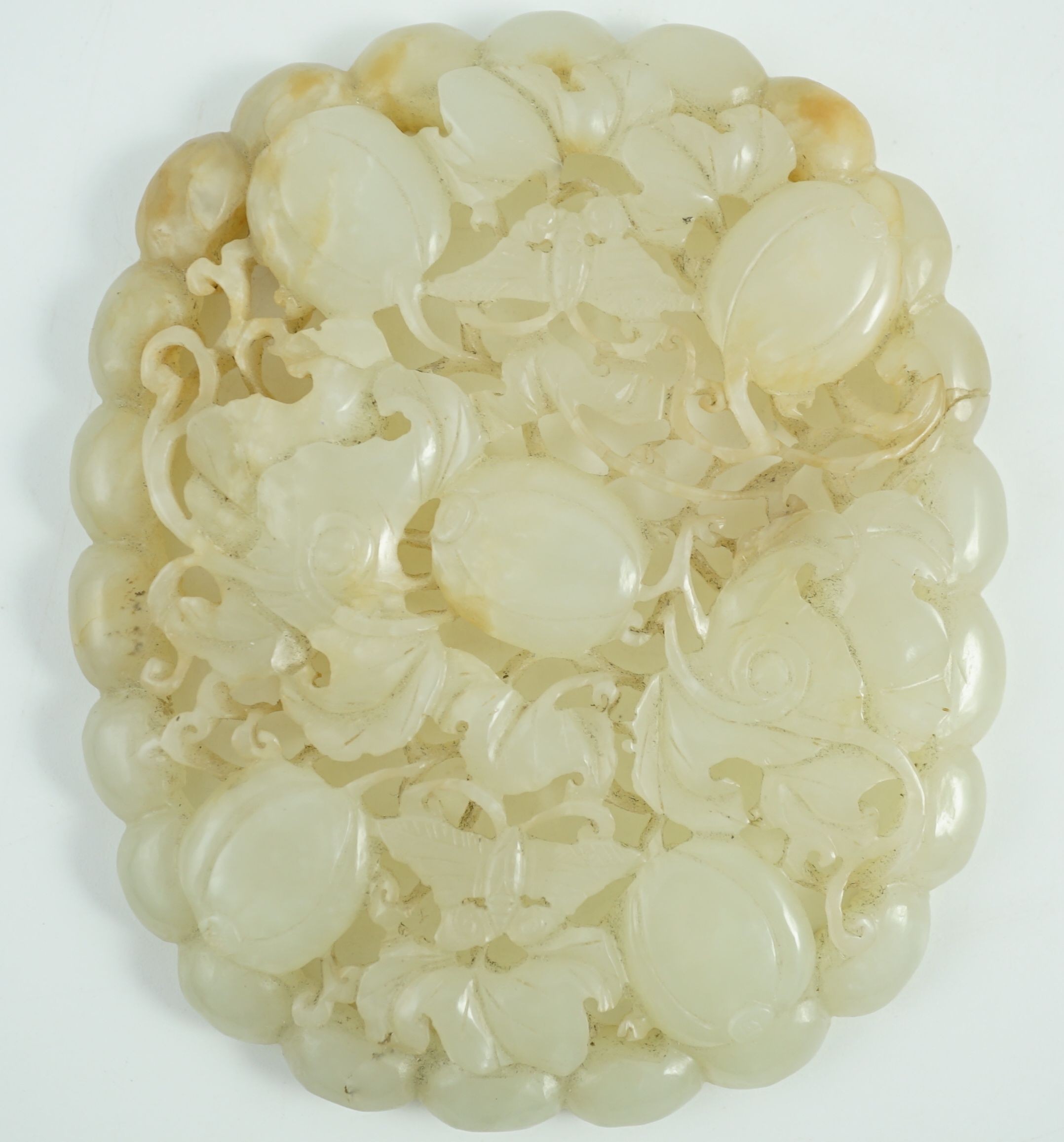 A Chinese pale celadon jade oval openwork plaque, 19th century, 9.8 cm x 8.2 cm